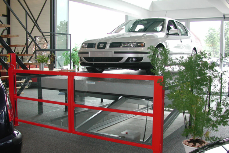silver car on lift table