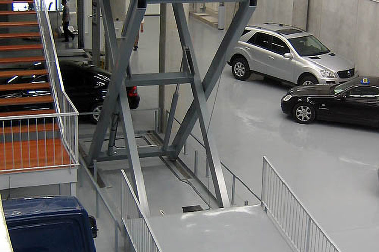 extended lift table in car dealership
